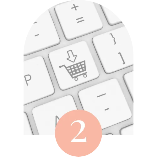 Close-up of a white keyboard showcasing a shopping cart icon