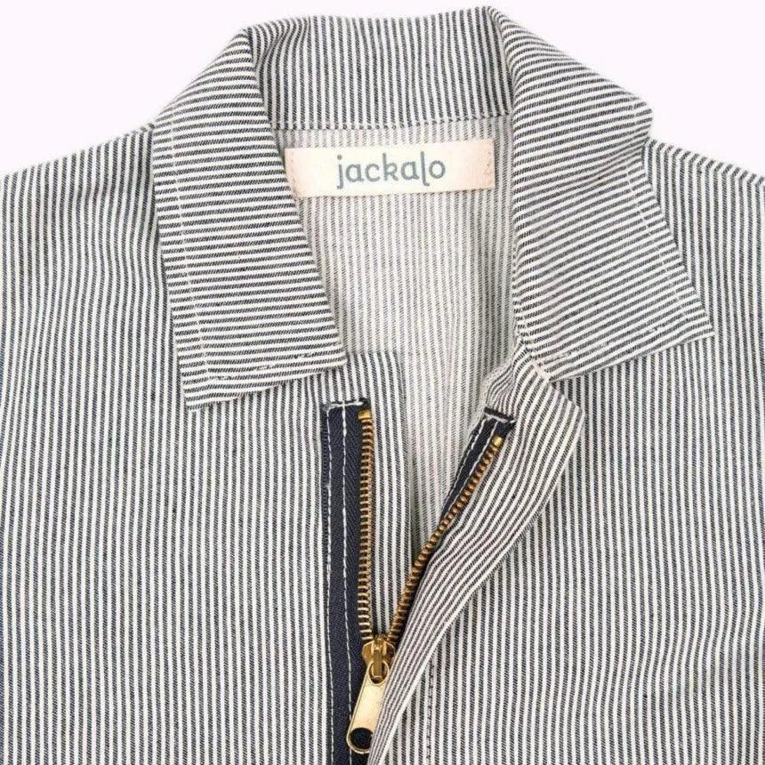 Close-up of Jackalo kids' striped coverall collar and brass zipper, sustainable clothing