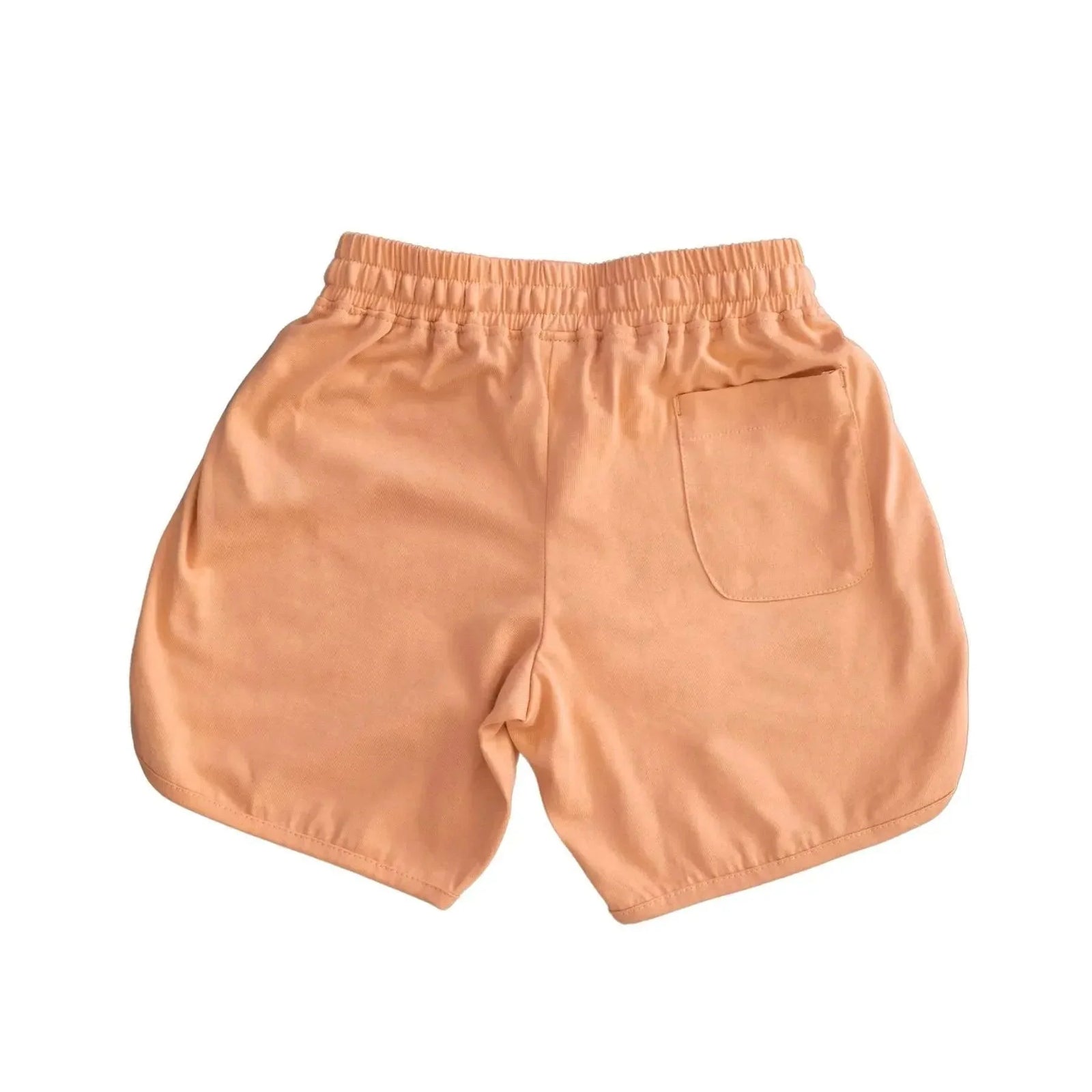 Peach kids shorts with elastic waistband and back pocket, sustainable Jackalo clothing.