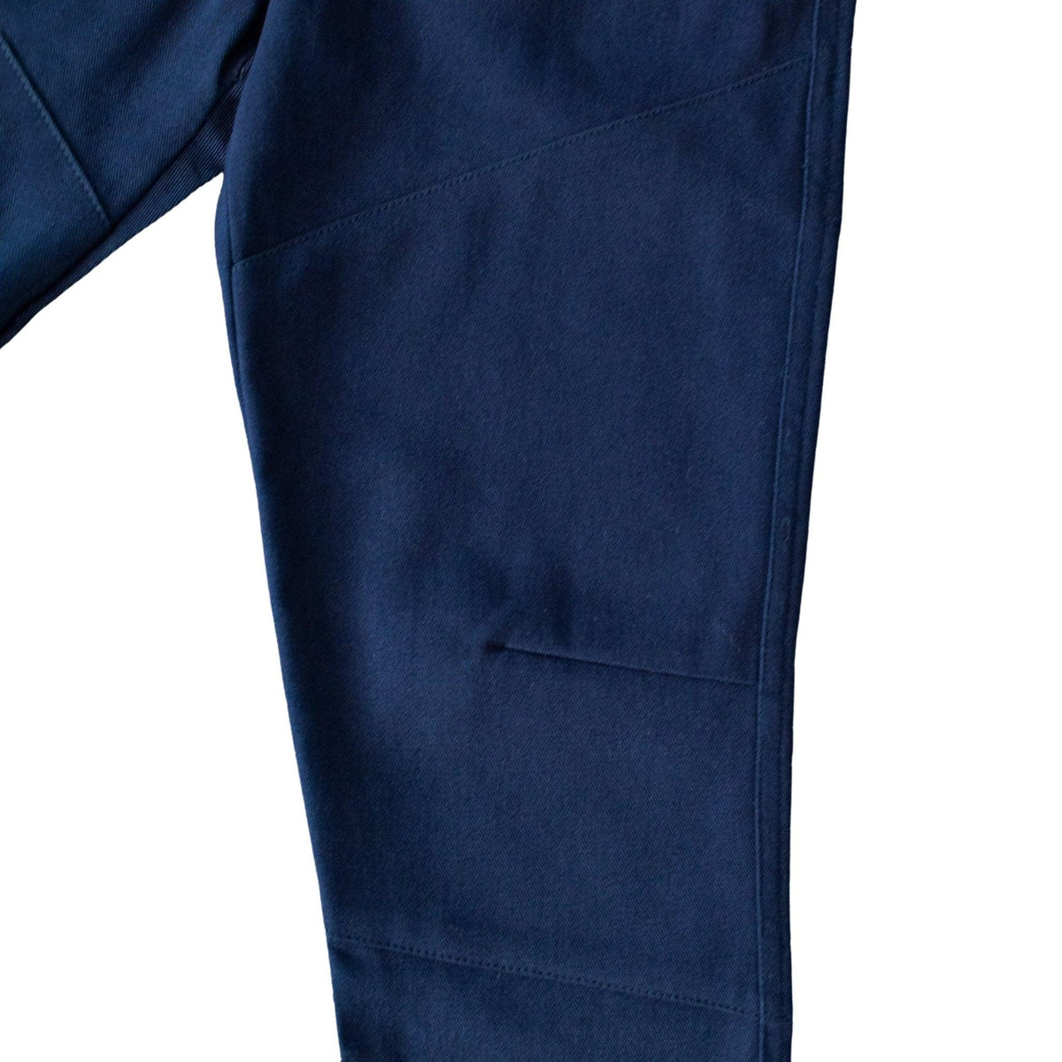 Detail of Jackalo kids' Ash Midnight Navy Pant, showing durable navy fabric and seam stitching.