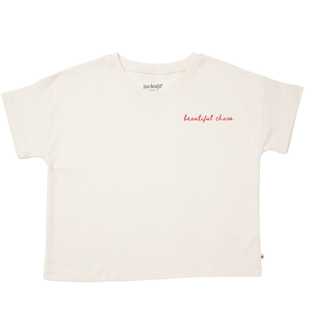 White t-shirt with 'beautiful chaos' text on a white background