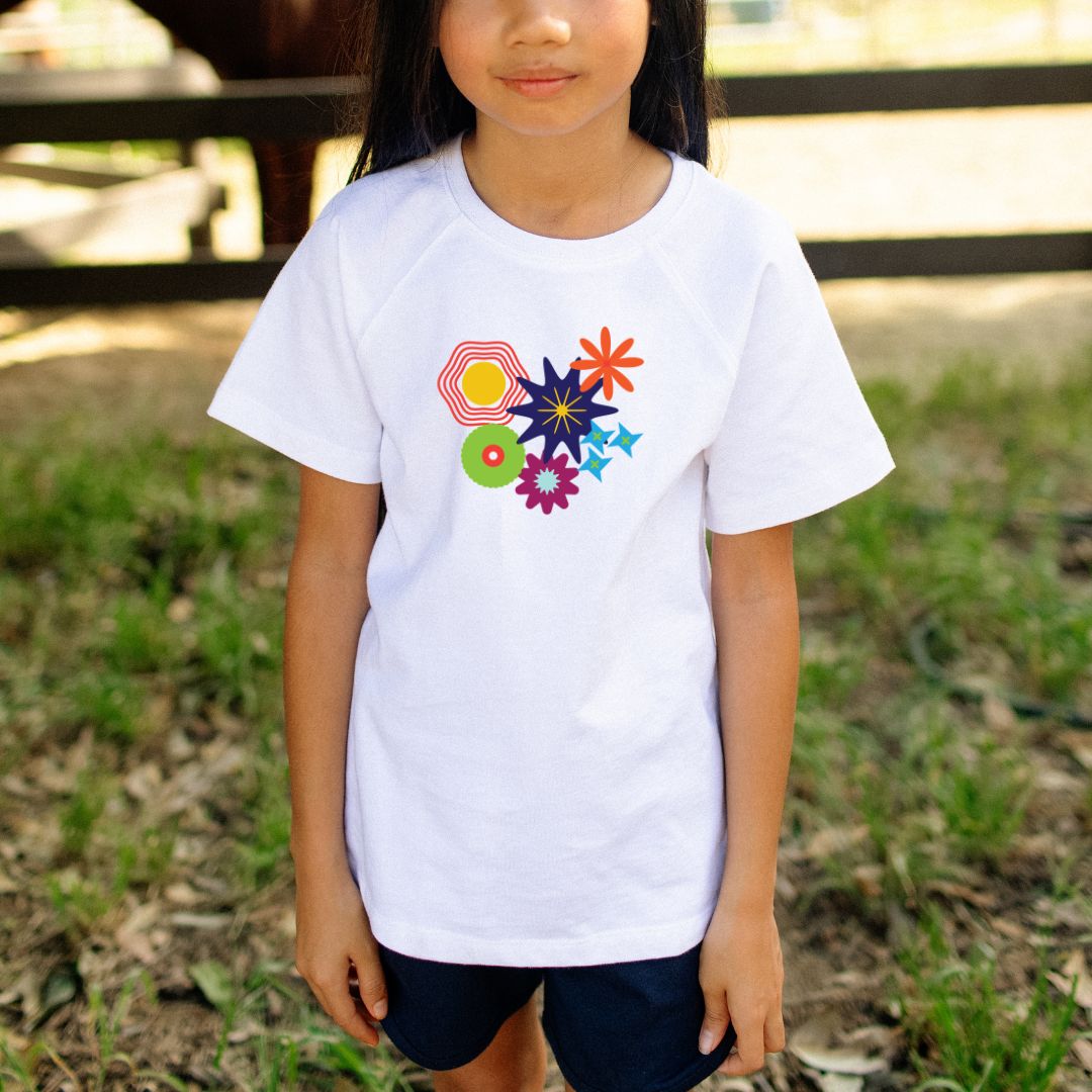 White t-shirt with colorful flower designs on a white background