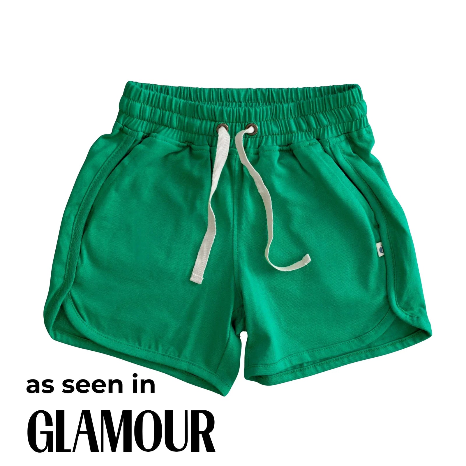 Green kids' shorts with drawstring, Jackalo sustainable activewear, featured in Glamour