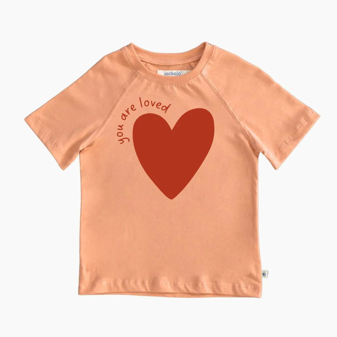 Peach kids t-shirt with red heart and 'you are loved' text by Jackalo, sustainable clothing