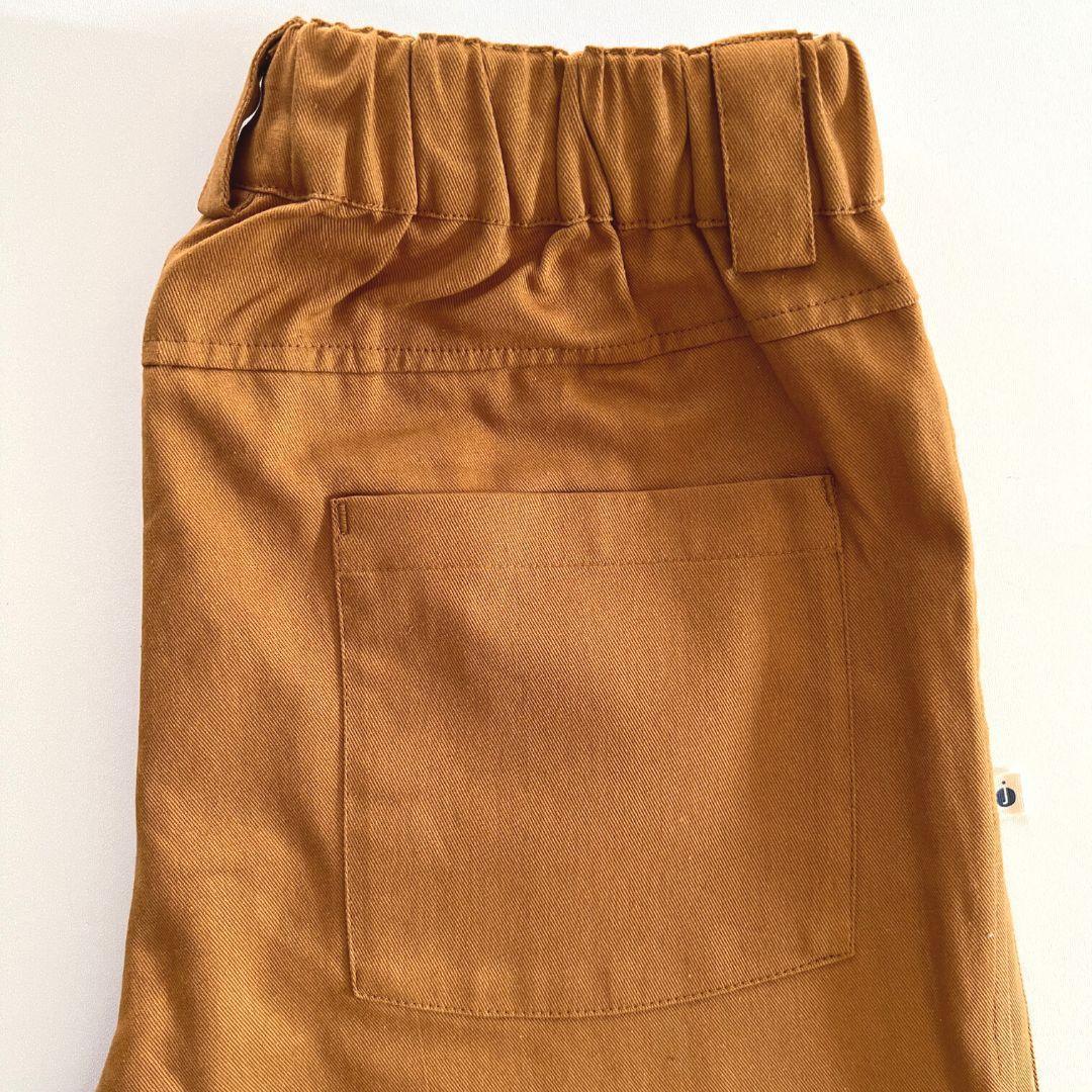 Acorn brown kids Charlie pants by Jackalo, featuring elastic waist and back pocket